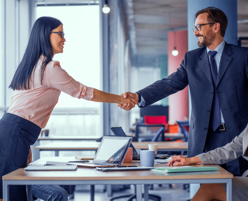 Two business teams successfully negotiating