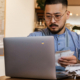 Business owner working with financial bills and calculates profit