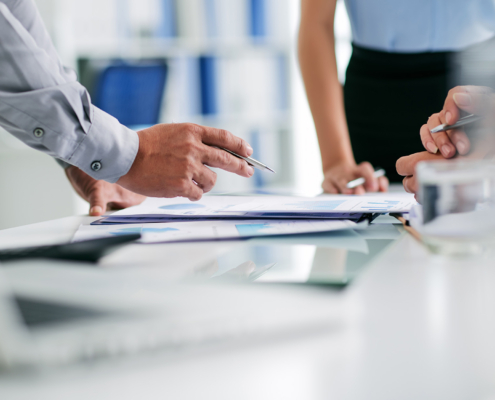 Hands of business people working with documents