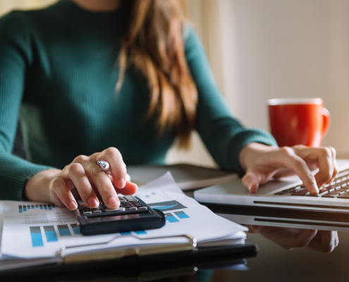 person in office using calculator