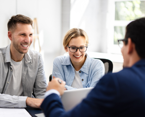 young couple is meeting with a financial planner