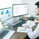 Business person analyzing charts on computer